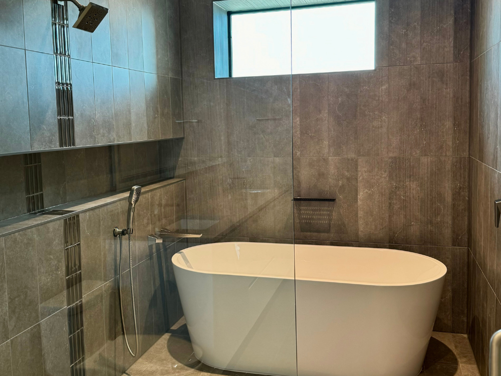 Freestanding bathtub in a walk-in shower